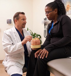 Brain surgeon talking with patient