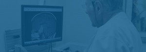 Physician looking at x-ray of brain